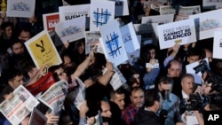 FILE - People rally in support of press freedom in Istanbul, Turkey, Oct. 9, 2015.