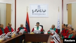 President of Libya's Supreme Court Kamal Edhan (C) chairs a hearing to discuss the legitimacy of Prime Minister Ahmed Maiteeq in Tripoli, Libya, June 9, 2014. 
