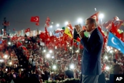 Turkish President Recep Tayyip Erdogan delivers a speech at a rally Rally in Istanbul, Aug. 7, 2016.