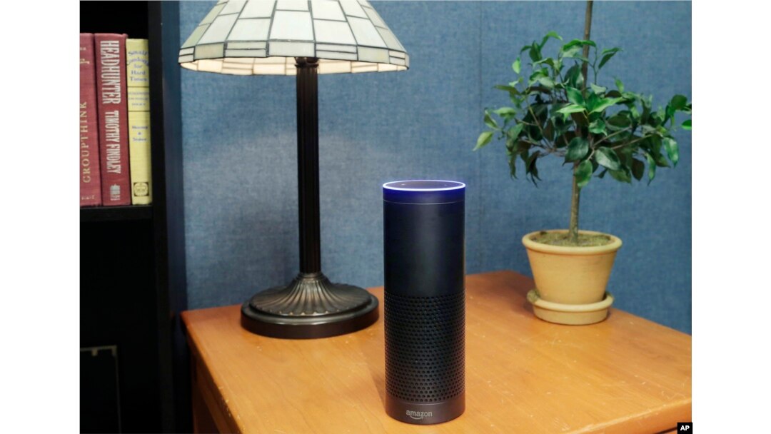 FILE - Amazon's Echo, an Alexa-compatible digital assistant that continually listens for commands such as for a song, a sports score or the weather, is pictured in New York, July 29, 2015.