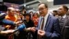 Cambodia's self-exiled opposition party founder Sam Rainsy, who has vowed to return to his home country, talks to supporters after being prevented from checking-in for a flight from Paris to Bangkok at Roissy Airport in Paris, France November 7, 2019. 