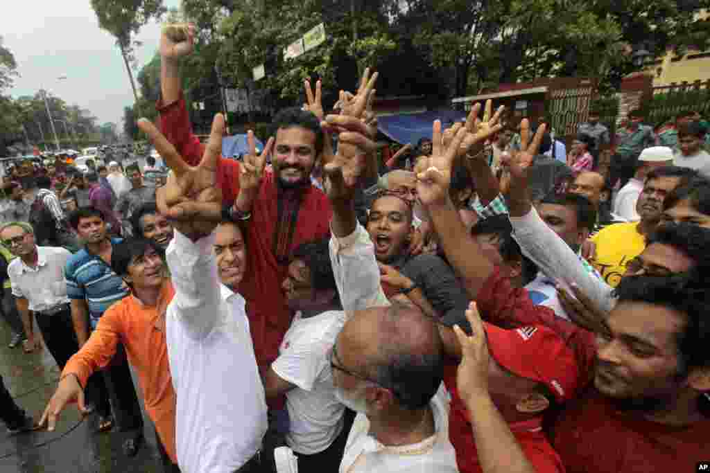Activists shout slogans and celebrate the verdict against Jemaat-e-Islami party leader Abdul Quader Mollah in Dhaka, Bangladesh, Sept. 17, 2013.