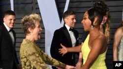 Frances McDormand, left, and Tiffany Haddish greet each other at the Vanity Fair Oscar Party on March 4, 2018, in Beverly Hills, Calif.