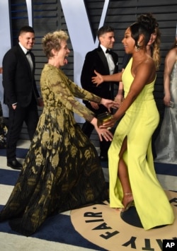 Frances McDormand, left, and Tiffany Haddish greet each other at the Vanity Fair Oscar Party on March 4, 2018, in Beverly Hills, Calif.