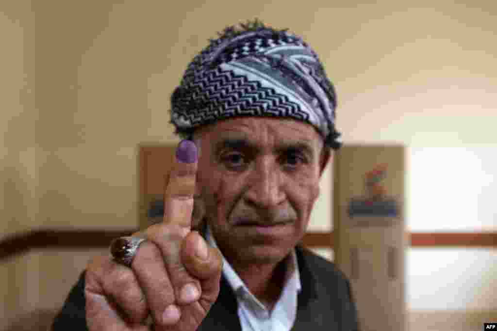 An Iraqi Kurdish man shows his ink-stained finger after voting in the Kurdish independence referendum in Arbil, the capital of the autonomous Kurdish region of northern Iraq.