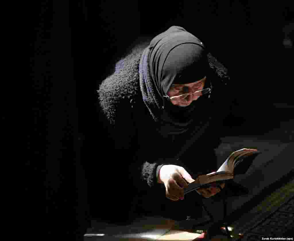 A Georgian Orthodox nun attends a religious service marking the Annunciation at the Svetitskhoveli Cathedral in Mtskheta, near Tbilisi.