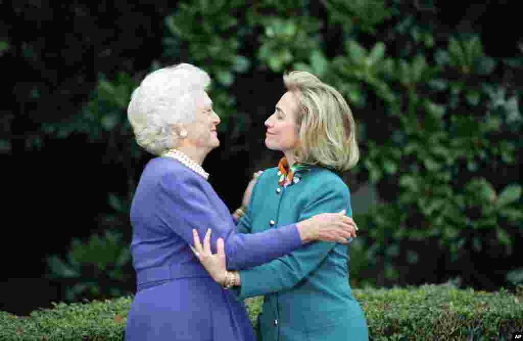 FILE - In this Nov. 19, 1992 file photo, first lady Barbara Bush greets first lady-to-be Hillary Clinton upon her arrival at the White House in Washington.