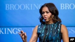 Michelle Obama speaks about "mobilizing for children's rights, supporting local leaders and improving girls' education", Dec. 12, 2014, at the Brookings Institution in Washington. 