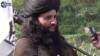 FILE - This undated image provided the SITE Intel Group, an American private terrorist threat analysis company, shows Mullah Fazlullah in Pakistan. 