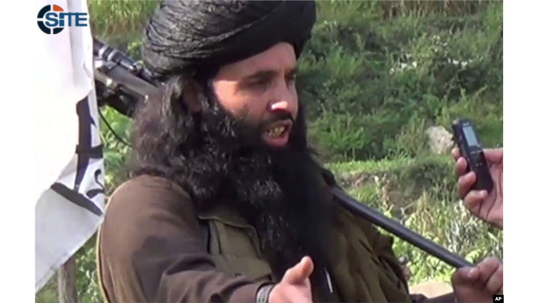 FILE - This undated image provided the SITE Intel Group, an American private terrorist threat analysis company, Mullah Fazlullah is seen being interviewed in Pakistan.