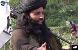 FILE - This undated image provided the SITE Intel Group, an American private terrorist threat analysis company, Mullah Fazlullah is seen being interviewed in Pakistan.