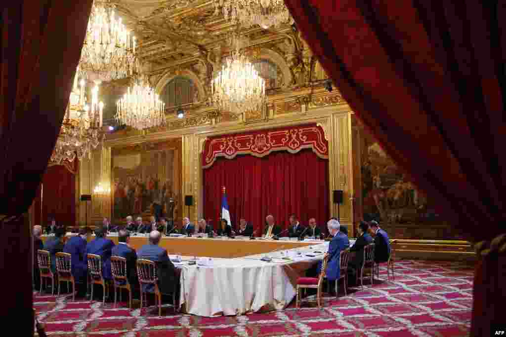 A photo shows a general view of the meeting table during the opening of the Strategic Attractiveness Council at the Elysee Palace in Paris.