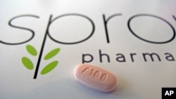 A tablet of flibanserin sits on a brochure for Sprout Pharmaceuticals in the company's Raleigh, N.C., headquarters.