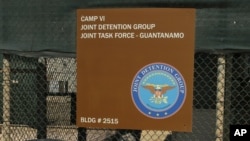 A sign for Camp 6 is posted outside the U.S. detention center at Guantanamo Bay, Cuba, Feb. 2, 2016. President Barack Obama has refused to send any suspected terrorists captured overseas to the detention center at Guantanamo Bay.