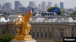 A view shows French and European flags flying half-mast at the Quai d'Orsay in Paris, France, July 28, 2014.