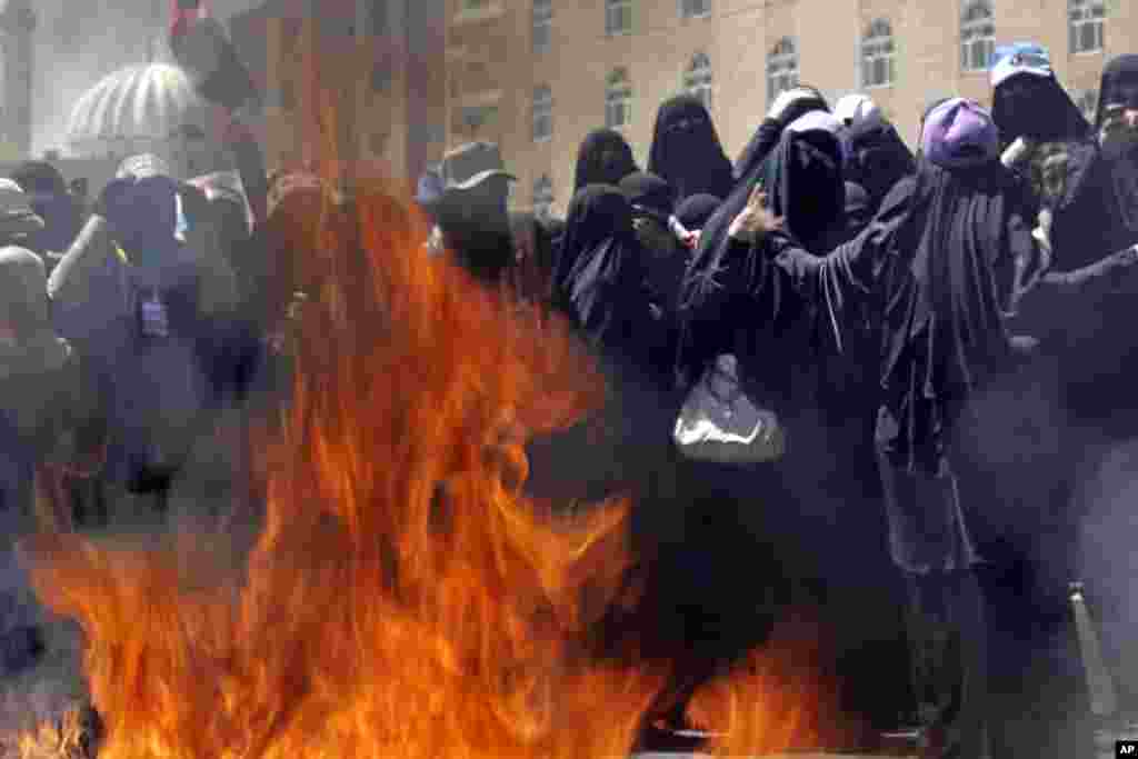 October 26, 2011:&nbsp; Yemeni women protestors burn veils during a demonstration in Sanaa, in a symbolic act meant to attract attention to recent crackdowns by government forces against the popular uprising.