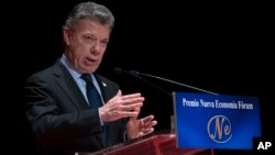 Nobel Peace Prize laureate and Colombia's President, Juan Manuel Santos, gives a speech after receiving the Nueva Economia Forum award at the Royal theatre in Madrid, Dec. 14, 2016. 