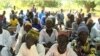 FILE - Parents listen as education officials encourage them to enroll their children school, in Ashigashia, Cameroon, April 15, 2019. (Moki Kindzeka/VOA) 