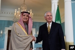 Secretary of State Rex Tillerson shakes hands with Saudi Foreign Minister Adel Al-Jubeir at the State Department in Washington, March 23, 2017.