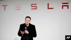 FILE - Elon Musk, CEO of Tesla Motors Inc., talks during a news conference at the company's headquarters in Fremont, California, Sept. 29, 2015.