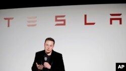 FILE - Elon Musk, CEO of Tesla Motors Inc., talks during a news conference at the company's headquarters in Fremont, California, Sept. 29, 2015.