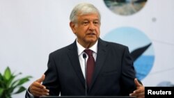 Leftist front-runner Andres Manuel Lopez Obrador of the National Regeneration Movement, gestures during the 16th National Tourism Forum at the Chapultepec Castle in Mexico City, Mexico, May 7, 2018. 