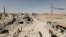 FILE - Damaged buildings are pictured during the fighting with Islamic State's fighters in the old city of Raqqa, Syria, Aug. 19, 2017. 