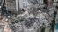 FILE PHOTO - This file aerial view, shows search and rescue personnel working on site after the partial collapse of the Champlain Towers South in Surfside, north of Miami Beach, on June 24, 2021.