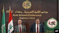 Iraq's Foreign Minister Hoshiyar Zebari (R) speaks during a joint Arab Summit conference with the Arab League's Deputy Secretary General for Political Affairs, Ahmad bin Hilly, in Baghdad, Iraq, March 28, 2012.