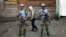 FILE - Two MONUSCO UN soldiers stand guard in Goma's port.
