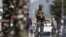Indian Central Reserve Police Force personnel stand guard on a street in Srinagar, October 12, 2021. 