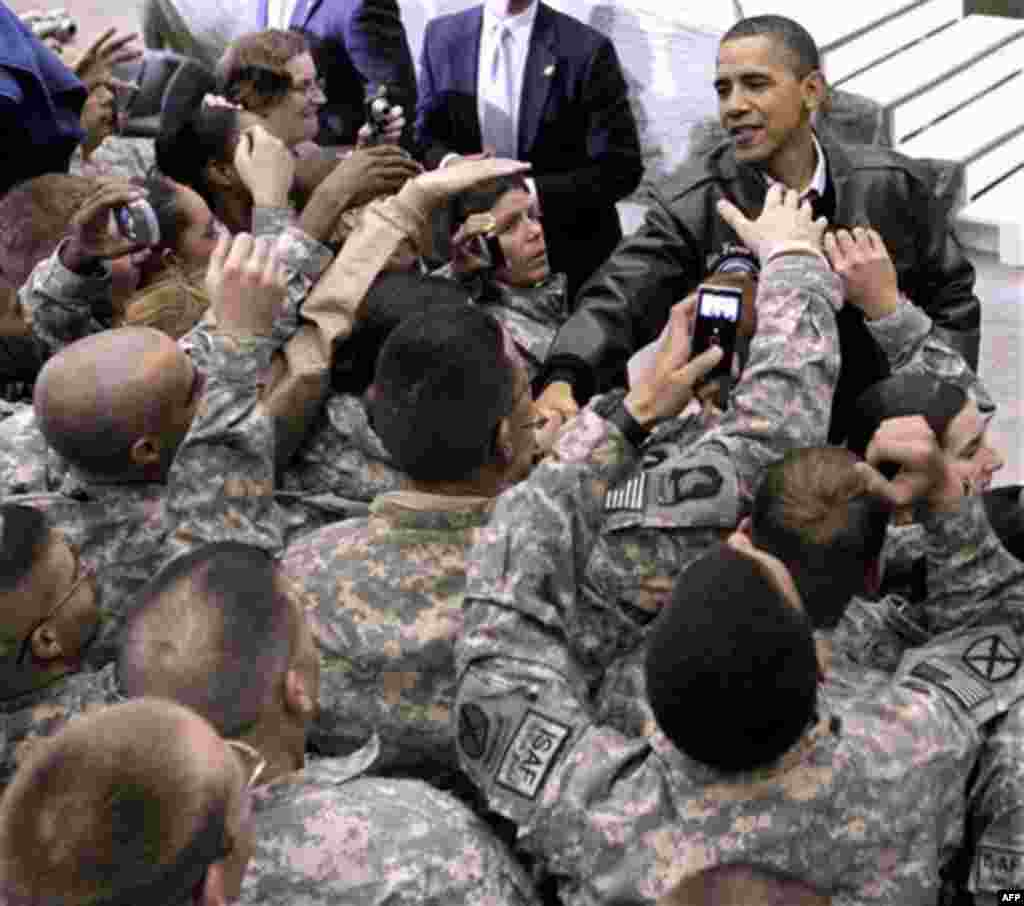 President Barack Obama greets troops at a rally during an unannounced visit at Bagram Air Field in Afghanistan, Friday, Dec. 3, 2010. (AP Photo/Pablo Martinez Monsivais)