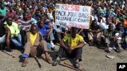 Striking Lonmin Platinum miners gather in Marikana, South Africa, where a new wage offer was rejected, Sept. 14, 2012. 