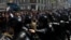 FILE - Police block a street during an unsanctioned rally in the center of Moscow, Russia, July 27, 2019.