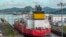 FILE - A cargo ship navigates through the Panama Canal on August 25, 2023. The number of ships allowed through the drought-hit Panama Canal each day will be increased thanks to signs of an improvement in water levels, authorities said on April 15, 2024.