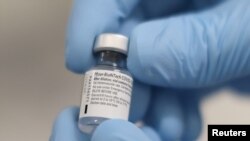 FILE - A vial of the Pfizer/BioNTech COVID-19 vaccine is seen ahead of being administered at the Royal Victoria Hospital, on the first day of the largest immunisation programme in the British history, in Belfast, Northern Ireland December 8, 2020.