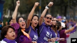 About 200 women form a human chain calling for an end to gender violence, on the eve of International Women's Day in central Mexico City, March 7, 2020. Protests against gender violence in Mexico have intensified in recent years.