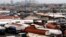 FILE - Trucks are seen parked around an automobile workshop overlooking Lagos. A recent strike by truck drivers is crippling trade between Nigeria and Cameroon.