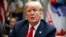 President Donald Trump listens to a reporter's question during a meeting of the President's National Council of the American Worker in the Roosevelt Room of the White House, Sept. 17, 2018, in Washington.