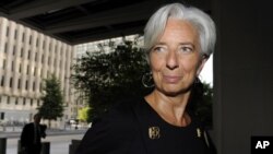 France's Minister of Economy Christine Lagarde arrives for a day of meetings ahead of her interview to potentially be the next managing director of the International Monetary Fund, at IMF headquarters in Washington, June 22, 2011.