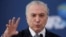 Brazil's President Michel Temer gestures during the launch of the new financing line of Bank Caixa Economica Federal at the Planalto Palace in Brasilia, Brazil, Nov. 24, 2016. 
