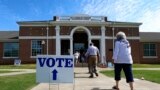 Voters arrive to cast their ballots during the Alabama Primary election at Huntingdon College in Montgomery, Ala., June 5, 2018. 