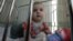 One-year-old Artur and his two-year-old brother Mark (not pictured) were brought to a local hospital in Russia's Siberian city of Krasnoyarskl by the police due to neglect by their parents. They are currently waiting to be put up for adoption, March 23, 2011.