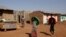 FILE - Eritrean refugee children walk within Mai-Aini refugee camp near the Eritrean boarder in the Tigrai region in Ethiopia, Feb. 10, 2016. 