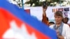 U.N. Special Rapporteur on Human Rights in Cambodia, Rhona Smith, delivers a speech to mark May Day at Tonle Sap river bank in Phnom Penh, Cambodia, Wednesday, May 1, 2019. Some hundreds of workers staged a rally, demanding a better working condition. (AP Photo/Heng Sinith)