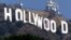 FILE - This 2001 photo shows the famed Hollywood sign in the Hollywood Hills with an American flag positioned over the letter O.