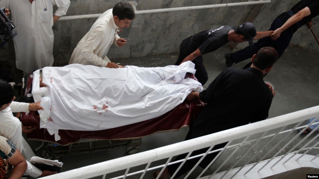 Hospital staff and relatives shift Sumbal, a female worker of an anti-polio drive campaign who was shot by unidentified gunmen, to the intensive care ward at a hospital in Peshawar May 28, 2013. 
