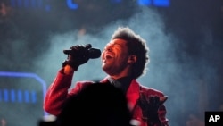 FILE - The Weeknd performs during the halftime show of the NFL Super Bowl 55 football game between the Kansas City Chiefs and Tampa Bay Buccaneers, on Feb. 7, 2021, in Tampa, Fla. 