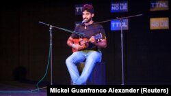 Noche Blanca plays the quatro at the monthly spoken word event "True Talk No Lies" in Port of Spain, Trinidad and Tobago, May 23, 2018.