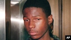 In this file photo, Malcolm Shabazz, the grandson of political activist Malcolm X, leaves Family Court after a detention hearing, in Yonkers, N.Y., July 1999.